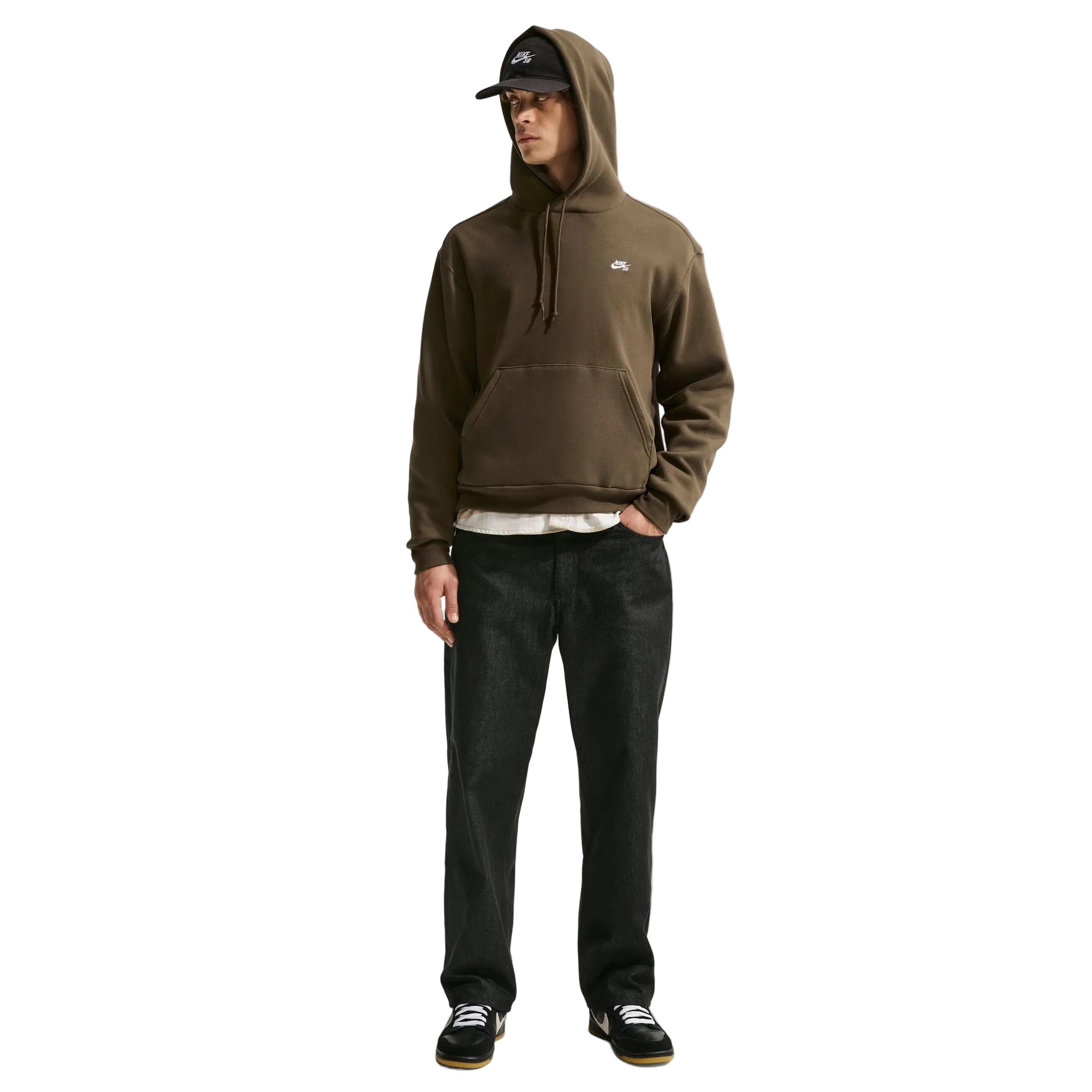 Man wearing a brown hoodie and black pants on a white background