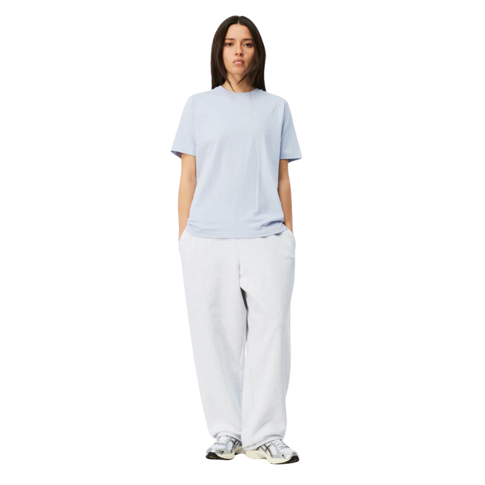 Person wearing a light blue t-shirt and white pants on a white background