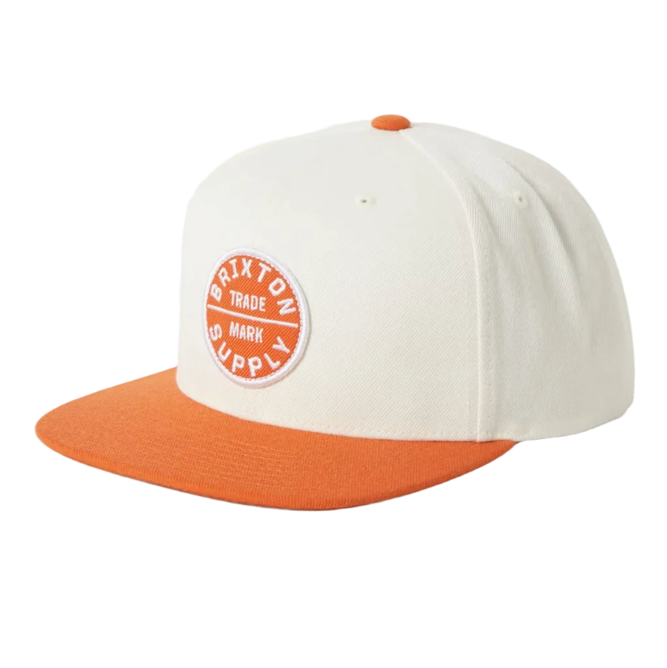 White and orange cap with a circular logo on a white background