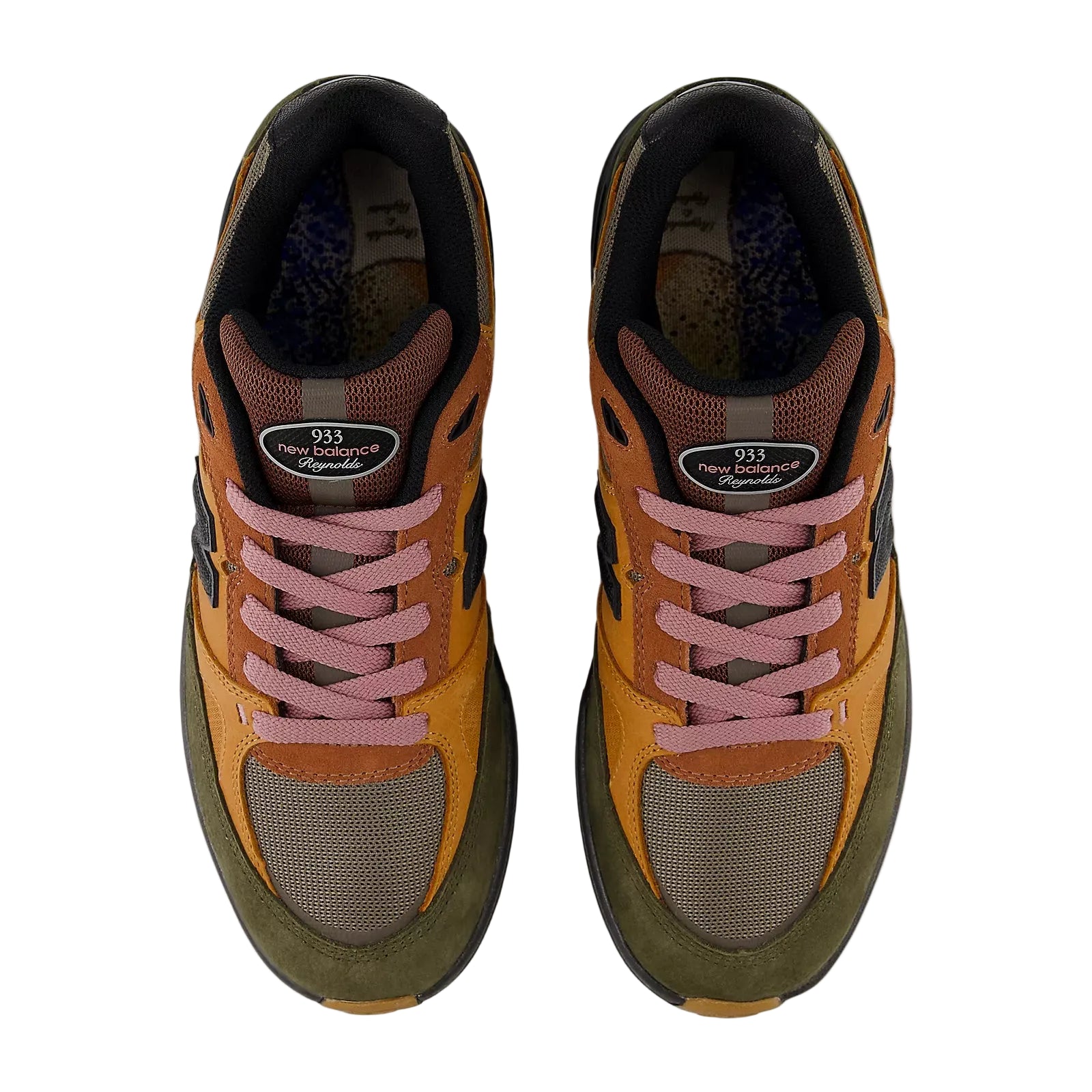 Pair of orange and brown sneakers with pink laces on a white background
