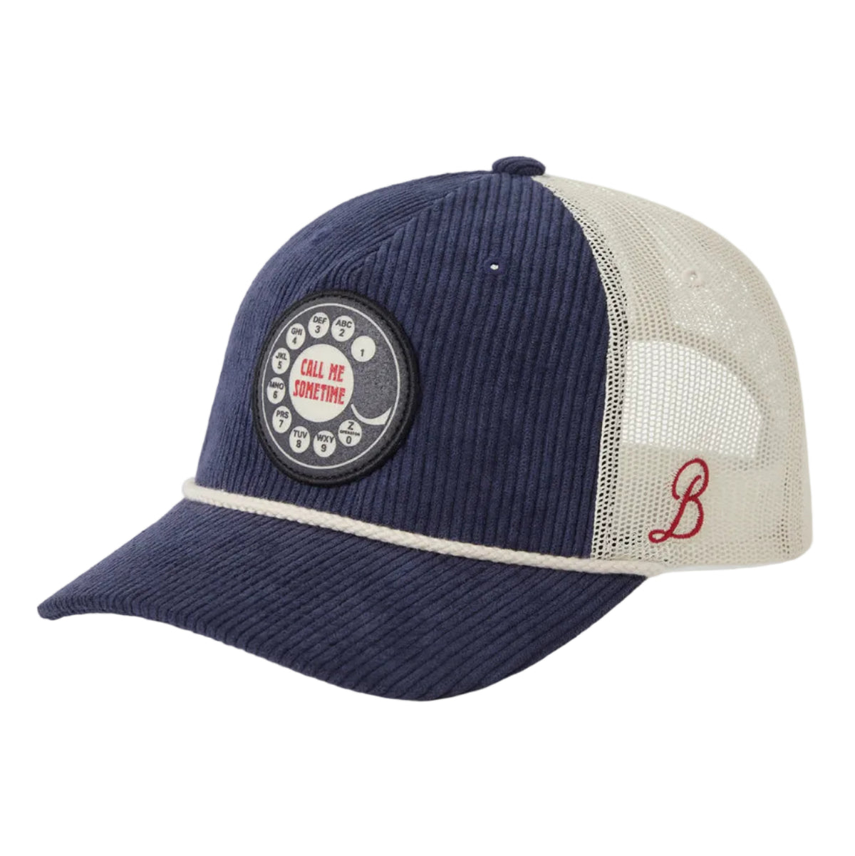 A navy blue and beige trucker cap with a corduroy front panel, beige mesh back, a circular patch on the front, and a red embroidered 'B' logo on the side, shown on a light gray background.