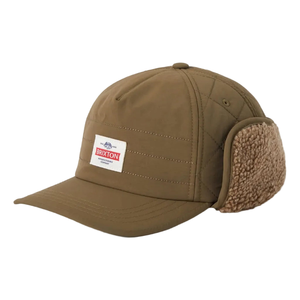 A brown nylon winter cap with attached fleece ear flaps and a small white rectangular brand patch on the front, photographed on a light gray background.