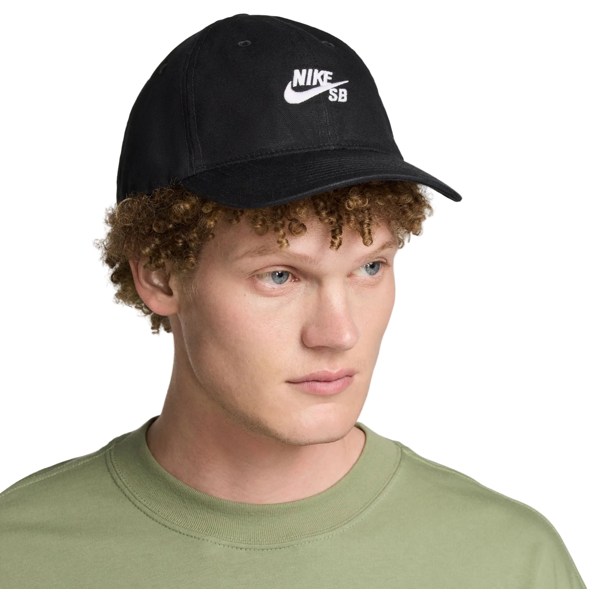 Person wearing a black Nike cap with a white logo on a light gray background