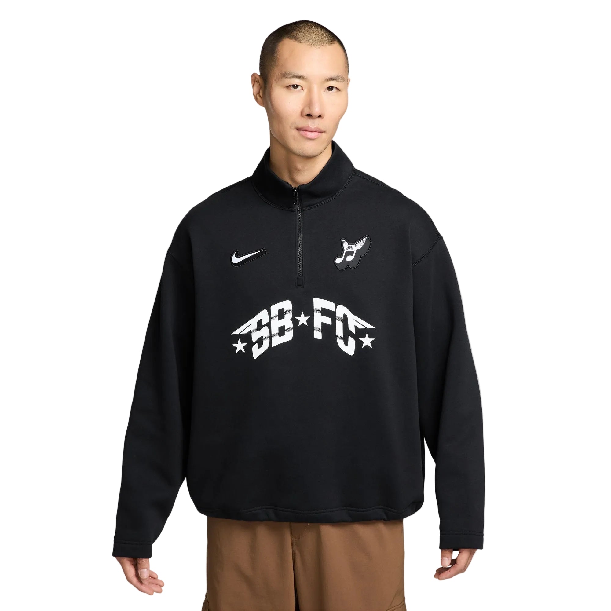 Man wearing a black Nike sweatshirt with white branding on a light gray background