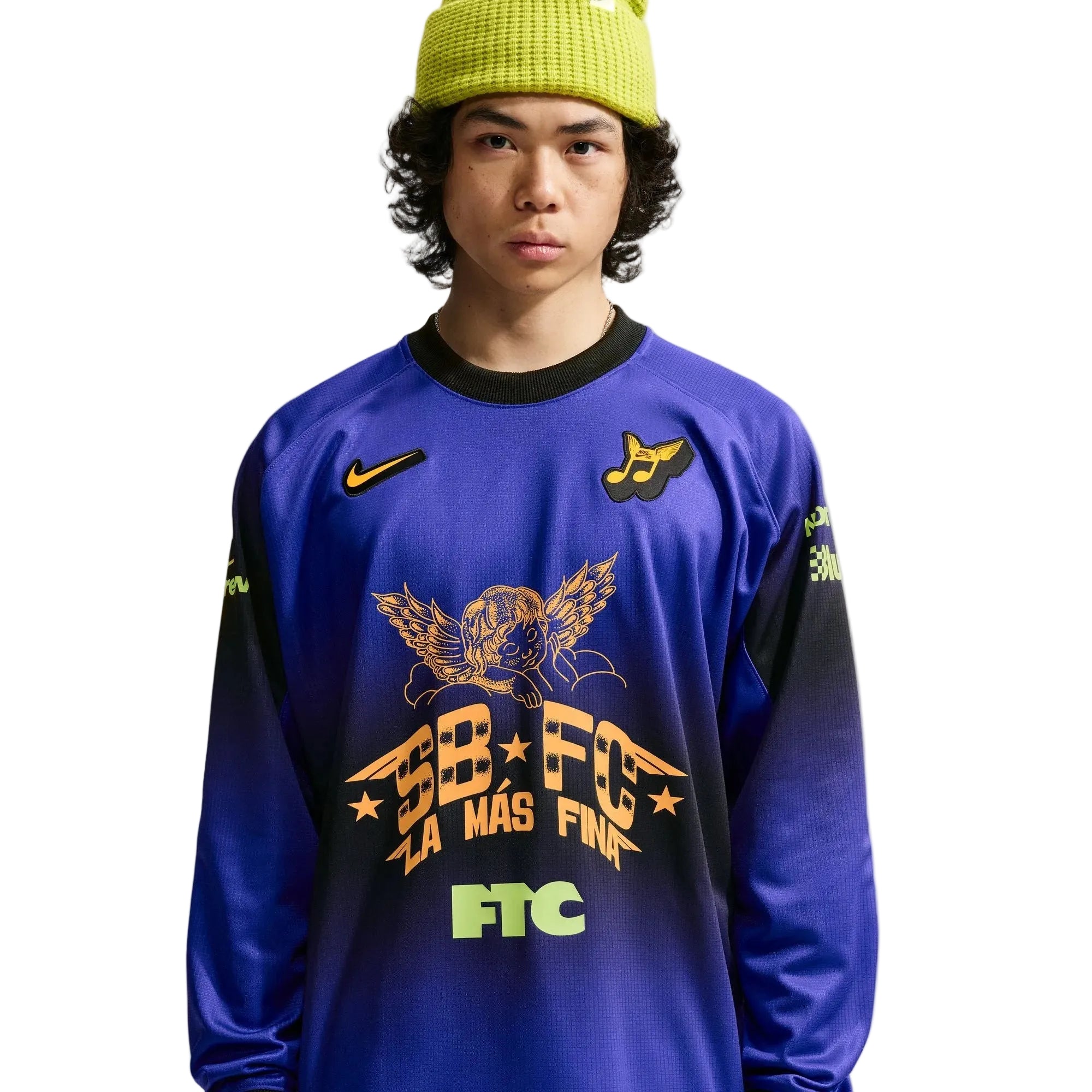 Person wearing a blue sports jersey with branding and text on a white background