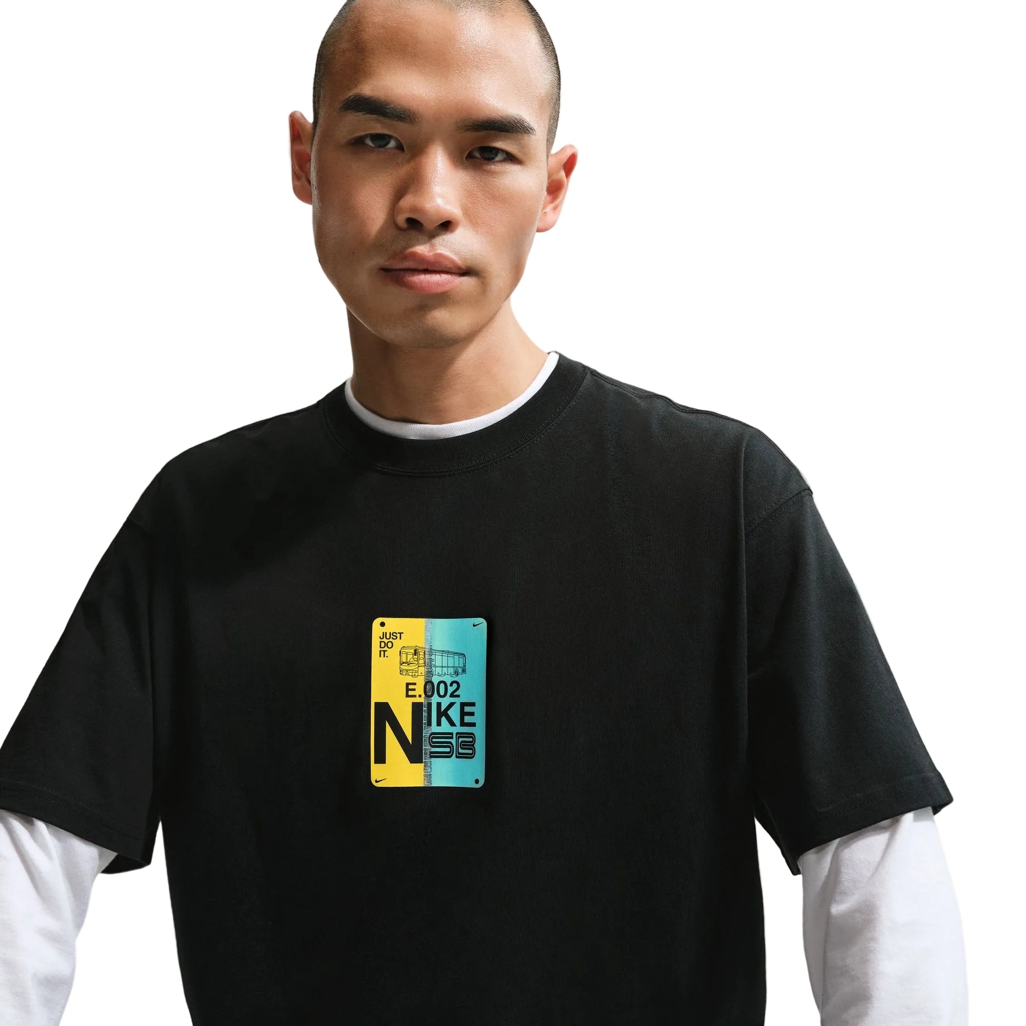 Person wearing a black t-shirt with a colorful logo on a plain background