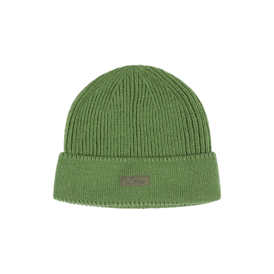 Green knit beanie with a brand logo on a light gray background