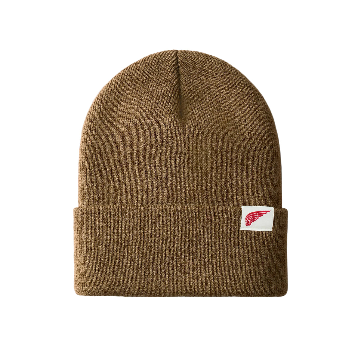A brown ribbed knit beanie hat with a folded cuff, featuring a small white square patch on the side with a red wing logo, set against a light gray background.