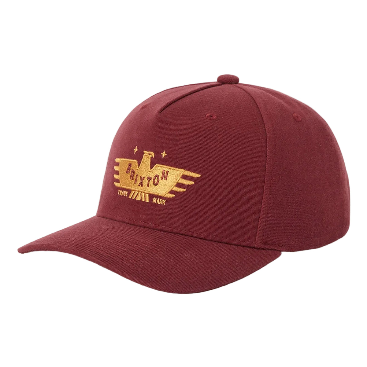 A maroon cotton baseball cap with a gold embroidered logo on the front. The logo features an eagle with the word 'Brixton"